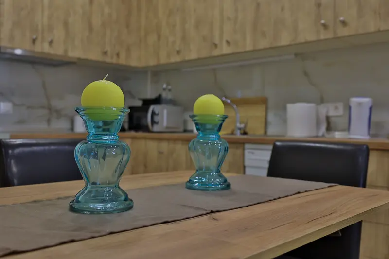 Kitchen table with blue glass candle holders