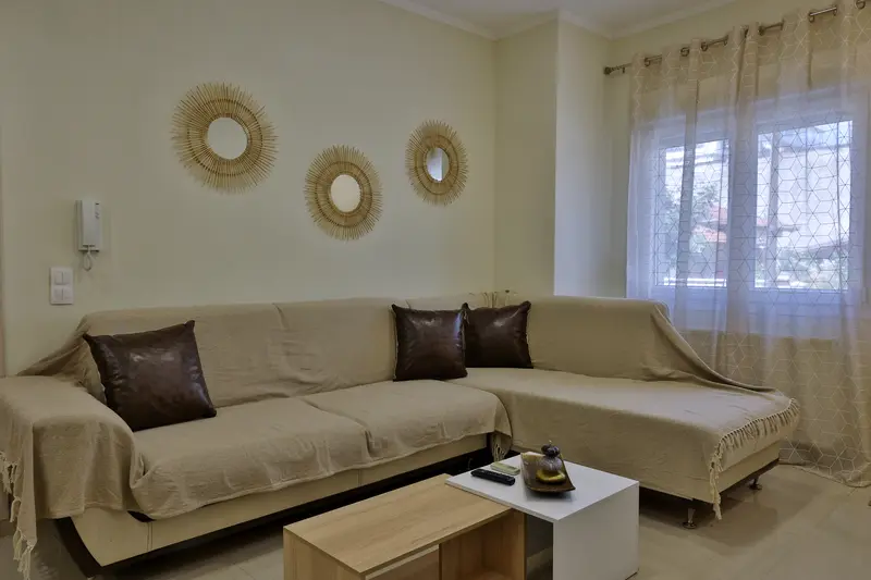 Living room with rattan sun mirrors
